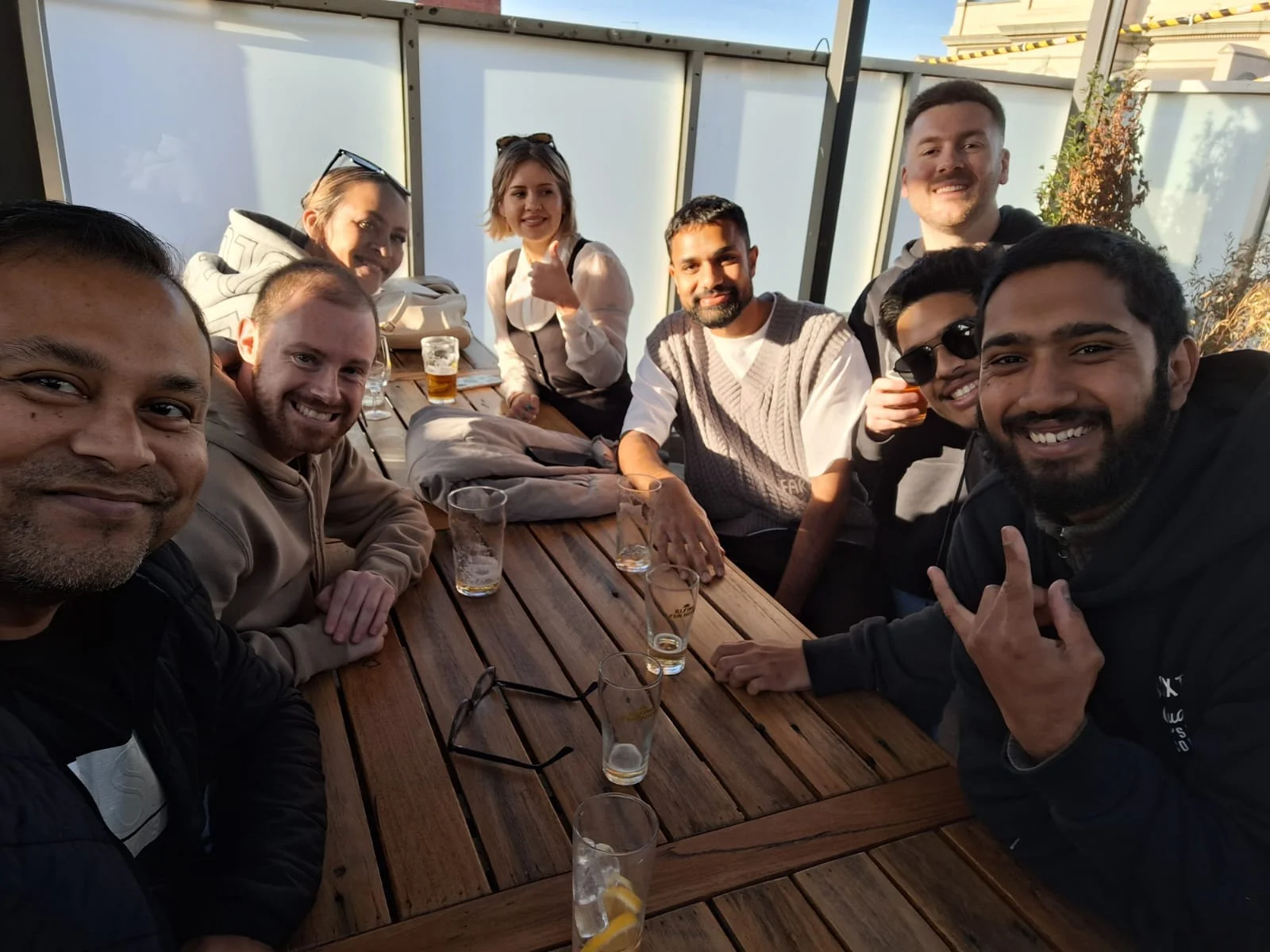 Taskforce Australia team members enjoying after-work drinks together outdoors in Melbourne
